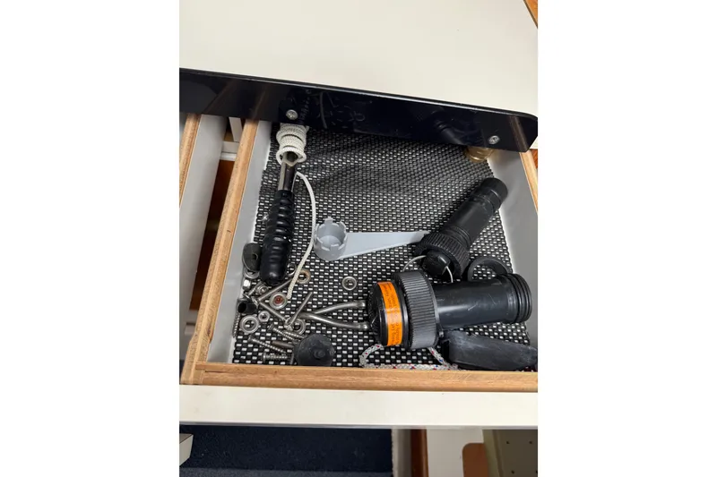 Slide: The Image of Drawer with tools and accessories in a 1998 Catalina 250 sailboat. - 49