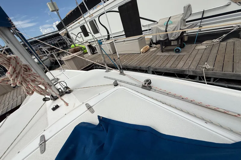 Slide: The Image of Sailboat deck view of a 1998 Catalina 250 docked at a marina. - 35