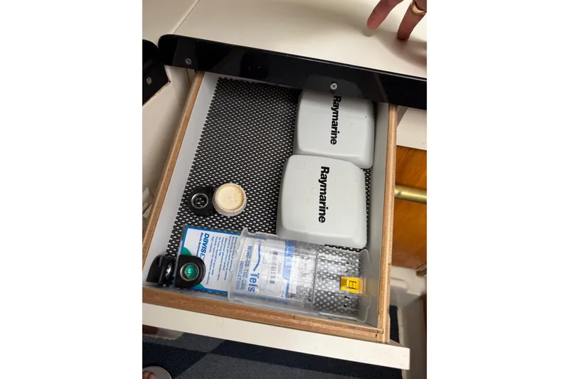 Slide: The Image of Drawer with Raymarine equipment and accessories in a 1998 Catalina 250 sailboat. - 48