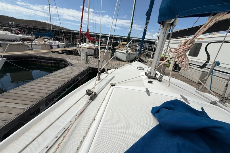 Slide: The Image of Sailboat docked at marina, Catalina 250 model, 1998, with clear sky background. - 33