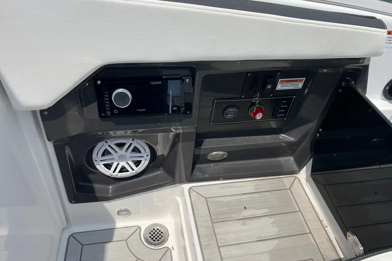 Slide: The Image of 2024 Monterey 275SS Super Sport boat dashboard with audio system and controls. - 41