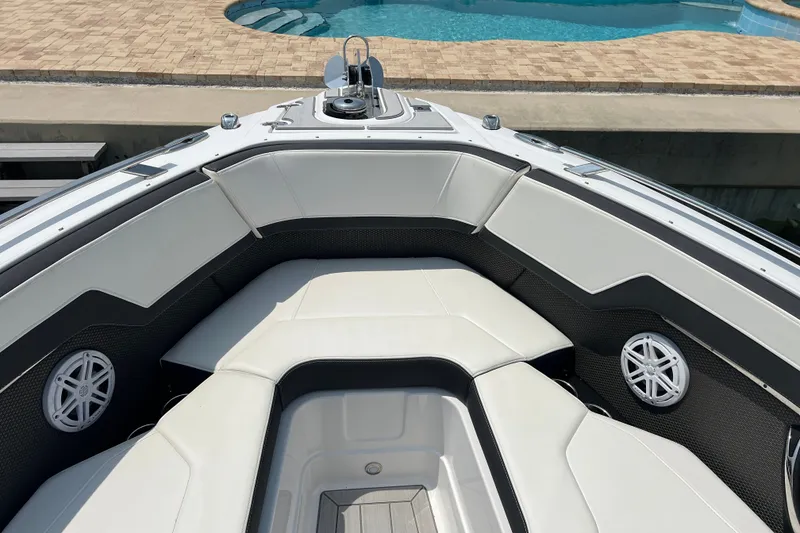 Slide: The Image of 2024 Monterey 275SS Super Sport boat interior with white seating and speakers. - 12