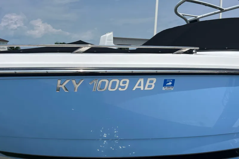 Slide: The Image of 2024 Monterey 275SS Super Sport boat with registration KY 1009 AB, blue hull. - 3