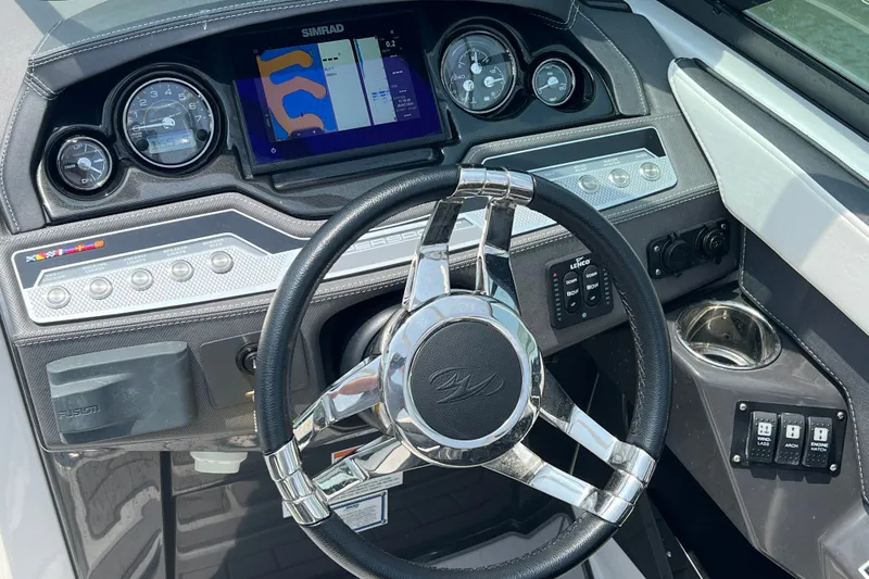 Slide: The Image of Dashboard of 2024 Monterey 275SS Super Sport boat with steering wheel and control panel. - 21