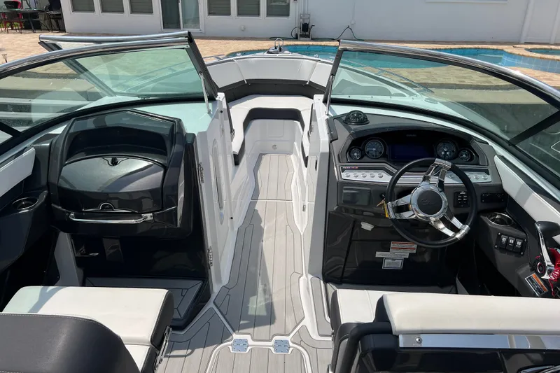 Slide: The Image of 2024 Monterey 275SS Super Sport boat interior with modern dashboard and steering wheel. - 30