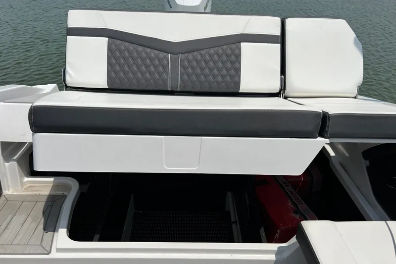 Slide: The Image of 2024 Monterey 275SS Super Sport boat seat with storage compartment, on calm water. - 47