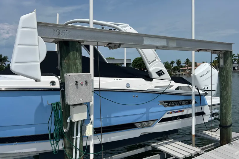 Slide: The Image of 2024 Monterey 275SS Super Sport boat docked, featuring sleek design and modern amenities. - 4
