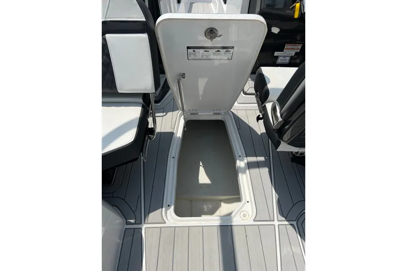 Slide: The Image of 2024 Monterey 275SS Super Sport boat interior storage compartment open. - 52