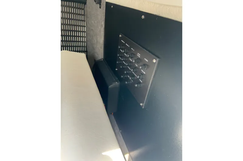 Slide: The Image of Control panel inside 2024 Monterey 275SS Super Sport boat, featuring multiple switches. - 29