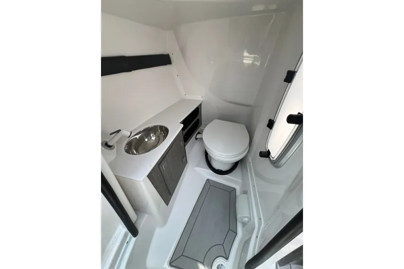 Slide: The Image of 2024 Monterey 275SS Super Sport boat interior bathroom with sink and toilet. - 34