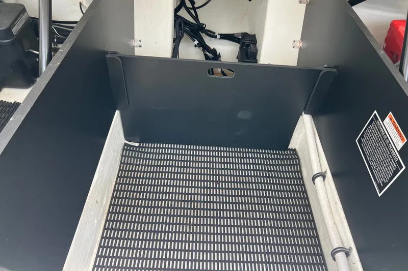 Slide: The Image of Interior view of 2024 Monterey 275SS Super Sport boat compartment with warning label. - 49