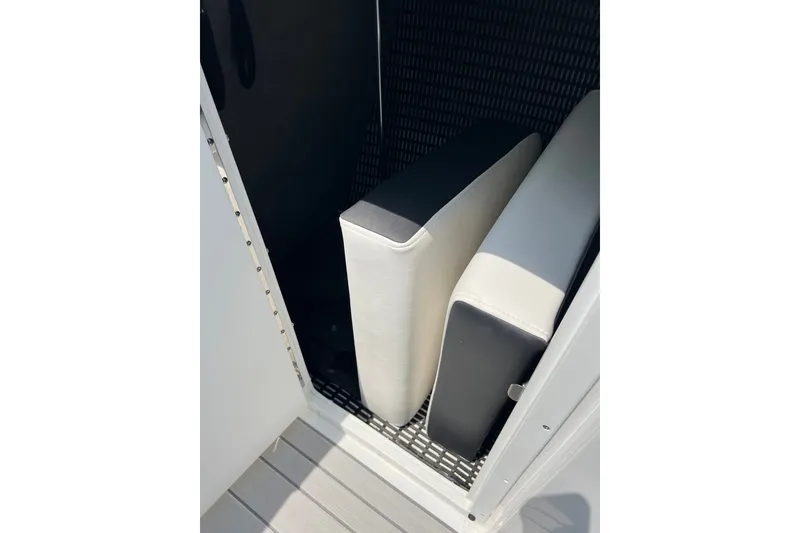 Slide: The Image of Storage compartment with cushions in a 2024 Monterey 275SS Super Sport boat. - 26