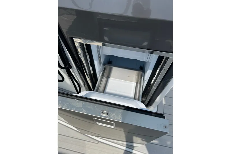 Slide: The Image of Open storage compartment on 2024 Monterey 275SS Super Sport boat. - 39
