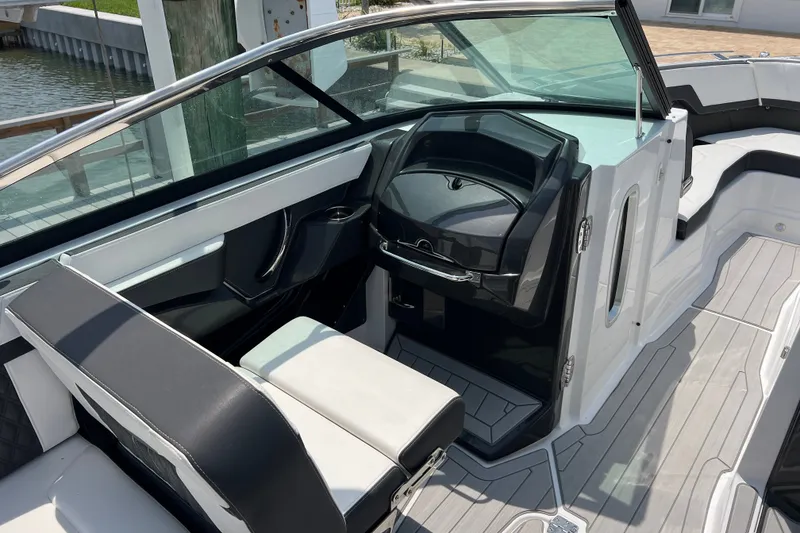 Slide: The Image of 2024 Monterey 275SS Super Sport boat interior with sleek seating and modern dashboard design. - 32