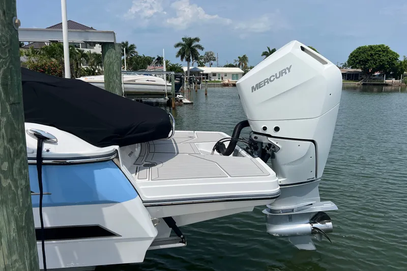 Slide: The Image of 2024 Monterey 275SS Super Sport boat with Mercury outboard engine docked by the water. - 5