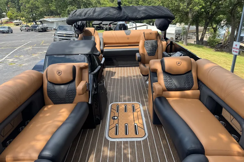 Slide: The Image of Luxurious 2027 Premier 230 Intrigue RLO - DL boat interior with tan and black seating. - 4