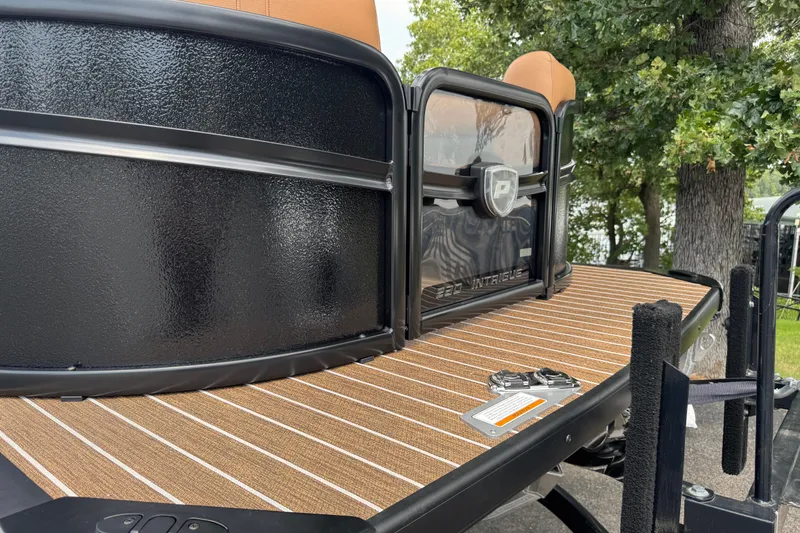 Slide: The Image of Premier 230 Intrigue RLO - DL 2027 boat with sleek black exterior and wood-patterned deck. - 15