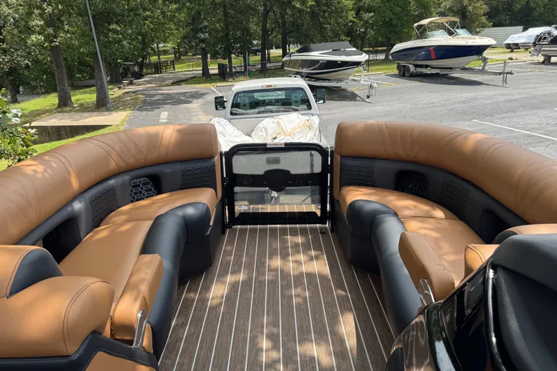 Slide: The Image of Luxurious interior of 2027 Premier 230 Intrigue RLO - DL pontoon boat at marina. - 10