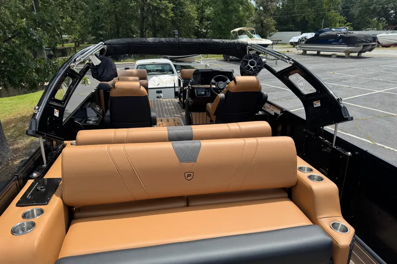 Slide: The Image of Luxurious 2027 Premier 230 Intrigue RLO - DL boat interior with tan leather seating. - 11