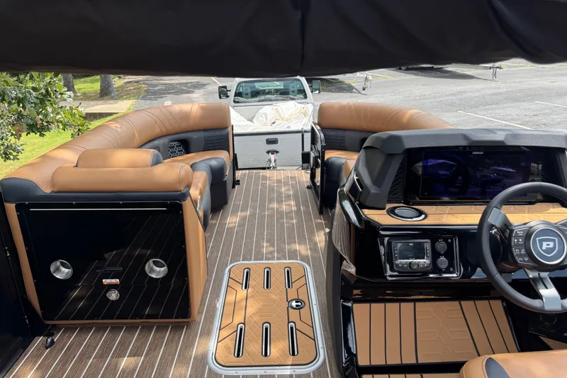 Slide: The Image of Luxurious interior of 2027 Premier 230 Intrigue RLO - DL pontoon boat with tan seating. - 5