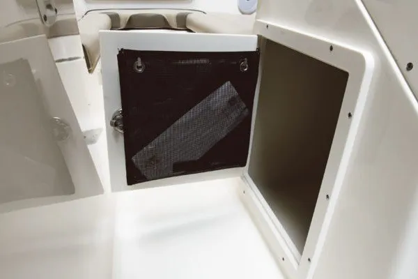 Slide: The Image of Open storage compartment on 2027 Key West 203 DFS boat interior. - 13