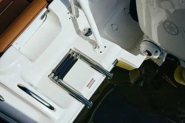 Slide: The Image of 2027 Key West 239 DFS boat with foldable swim ladder and sleek design. - 26