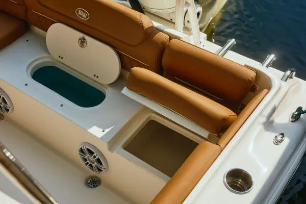 Slide: The Image of 2027 Key West 239 DFS boat interior with tan seating and storage compartments. - 22