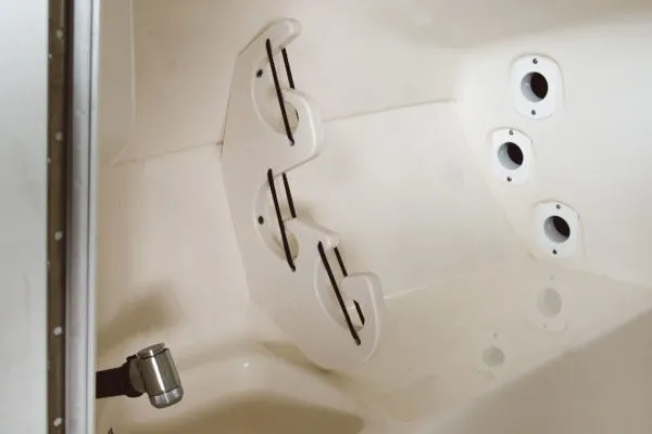 Slide: The Image of Interior view of a 2027 Key West 239 DFS boat, featuring rod holders and cup holders. - 15