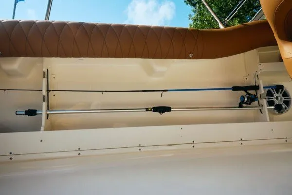 Slide: The Image of 2027 Key West 239 DFS boat interior with fishing rod storage and cushioned seating. - 29