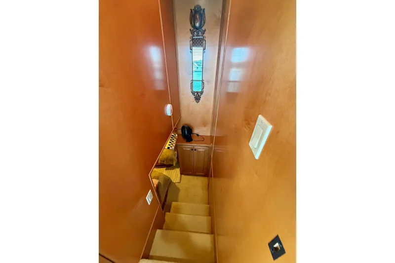 Slide: The Image of Staircase in 2008 Funtime 16x70 boat with wooden walls and decorative mirror. - 38
