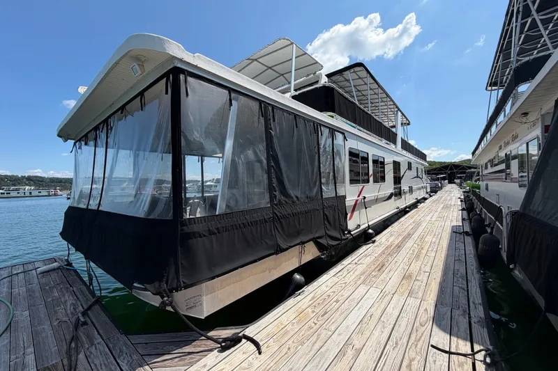 Slide: The Image of Houseboat docked on a sunny day, Funtime 16x70 model, 2008. - 1