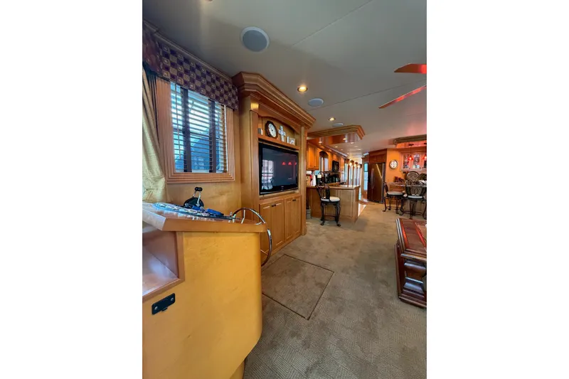 Slide: The Image of Luxurious interior of 2008 Funtime 16x70 houseboat with wood finishes and modern amenities. - 15