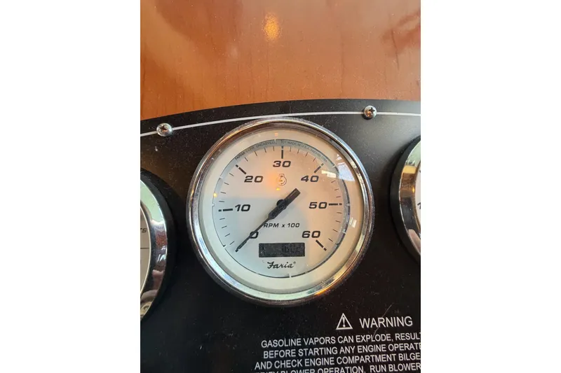 Slide: The Image of Close-up of a Faria tachometer on a 2008 Funtime 16x70 boat dashboard. - 29