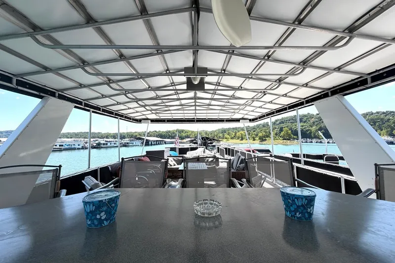Slide: The Image of Spacious deck of 2008 Funtime 16x70 houseboat with scenic lake view. - 5