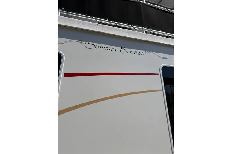 Slide: The Image of Side view of 2008 Funtime 16x70 houseboat named "Summer Breeze." - 51