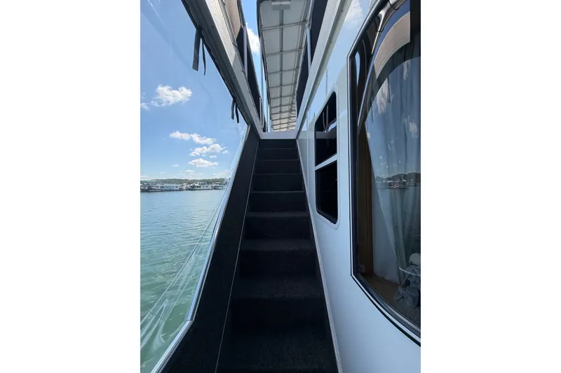 Slide: The Image of Staircase on 2008 Funtime 16x70 houseboat with scenic water view. - 50