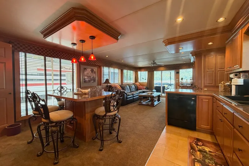 Slide: The Image of Luxurious 2008 Funtime 16x70 houseboat interior with elegant kitchen and cozy living area. - 24