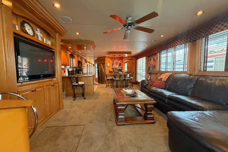 Slide: The Image of Luxurious interior of a 2008 Funtime 16x70 houseboat with elegant furnishings and modern amenities. - 17