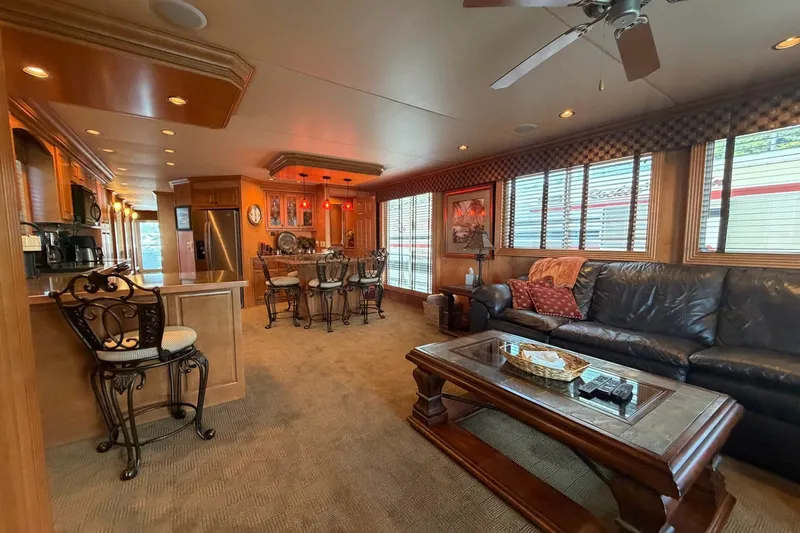 Slide: The Image of Luxurious interior of a 2008 Funtime 16x70 houseboat with elegant furnishings and modern kitchen. - 20
