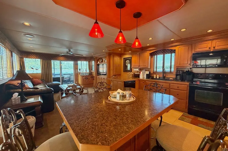 Slide: The Image of Luxurious 2008 Funtime 16x70 houseboat interior with modern kitchen and cozy living area. - 25