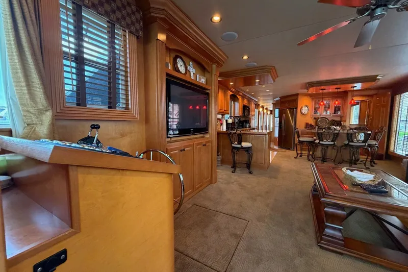 Slide: The Image of Luxurious interior of a 2008 Funtime 16x70 houseboat with elegant wood finishes and modern amenities. - 19