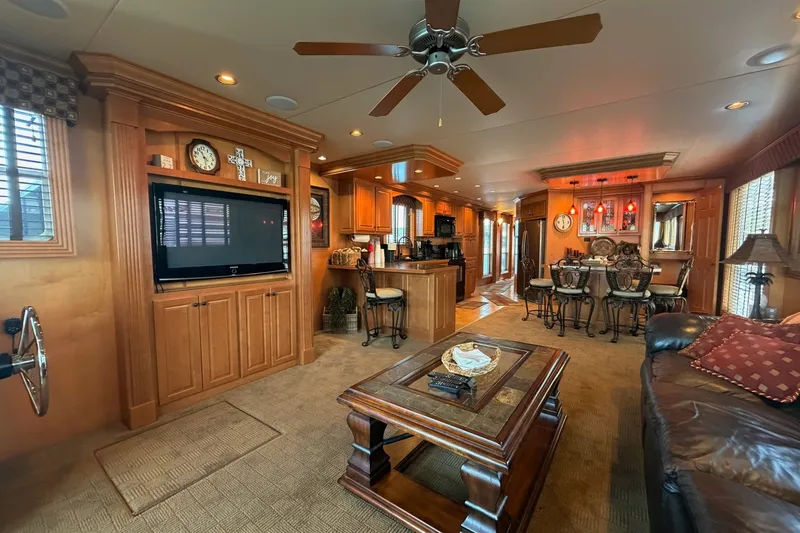 Slide: The Image of Luxurious 2008 Funtime 16x70 houseboat interior with elegant wood finishes and modern amenities. - 21