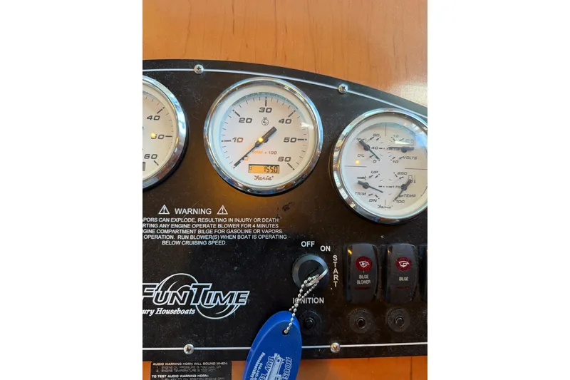 Slide: The Image of Control panel of a 2008 Funtime 16x70 houseboat with gauges and ignition switch. - 30