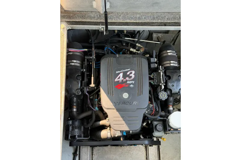 Slide: The Image of MerCruiser 4.3 MPI engine in a Lakeview boat, showcasing detailed components. - 51