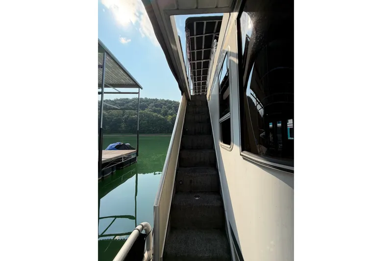 Slide: The Image of Staircase on a Lakeview boat with scenic lake and forest view. - 4