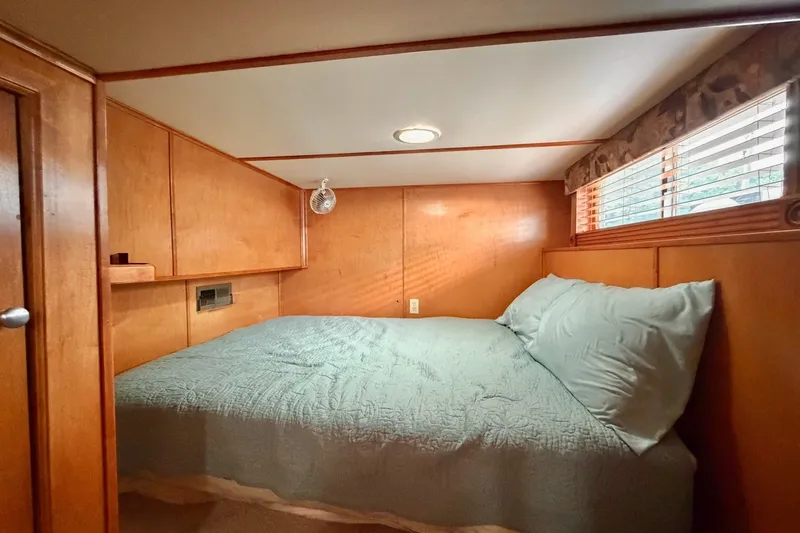 Slide: The Image of Cozy Lakeview cabin bedroom with wood paneling, soft lighting, and a comfortable bed. - 27