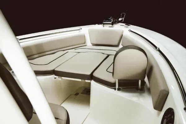 Slide: The Image of 2027 Key West 239 FS boat interior with cushioned seating and sleek design. - 13