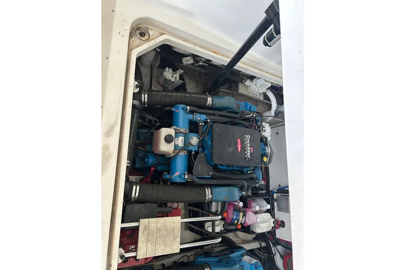Slide: The Image of Engine compartment of a 2002 Tiara Yachts 3500 Open, featuring a Crusader engine. - 39