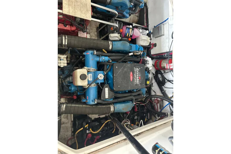Slide: The Image of Engine compartment of a 2002 Tiara Yachts 3500 Open, featuring marine components and wiring. - 37