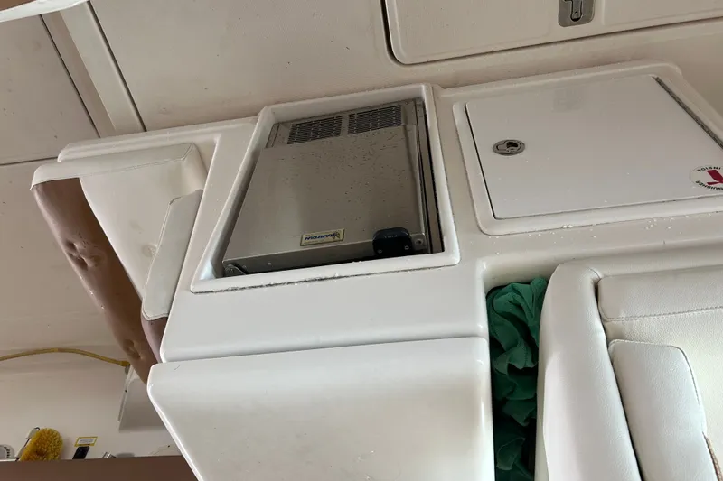 Slide: The Image of Interior view of a 2002 Tiara Yachts 3500 Open, featuring storage compartments. - 26